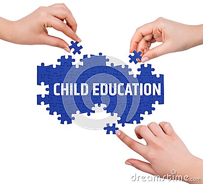 Hands with puzzle making CHILD EDUCATION word Stock Photo