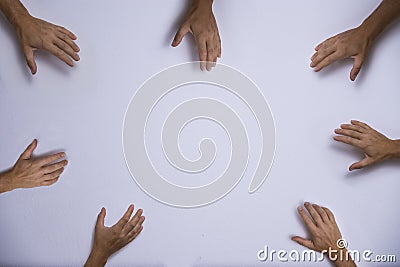 Hands reaching into the center Stock Photo