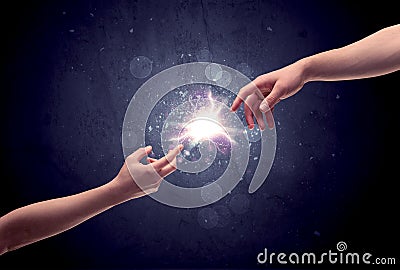 Hands reaching to light a spark Stock Photo