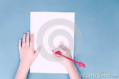 Hands with red V sign pencil, notepad Stock Photo
