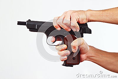 Hands reload gun on white background Stock Photo