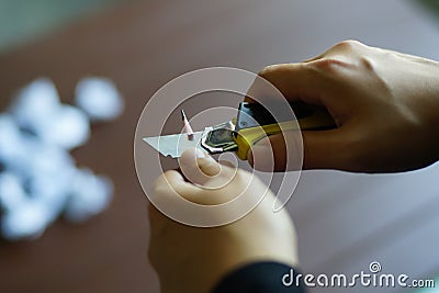 Hands sharpening pencil Stock Photo