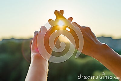 Hands show gesture symbol hashtag is viral, web, social media, network. Background is sunny urban sunset, concept for marketing, t Stock Photo