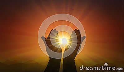 Hands with spark of hope, the light of faith, orange sunset background Stock Photo