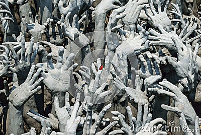 Hands statue from hell in Wat Rong Khun Stock Photo