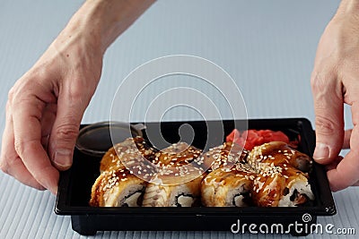 Hands sticks japan rolls Stock Photo