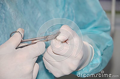 The hands of a surgeon during a surgical operation Stock Photo