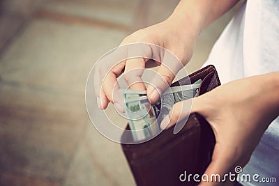 Hands taking out money from wallet Stock Photo