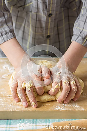 Hands teenage boy prepares the dough Stock Photo