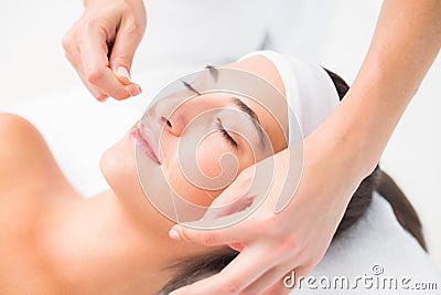 Hands threading beautiful womans upper lip Stock Photo