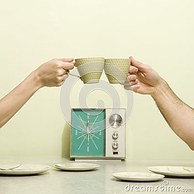 Hands toasting cups. Stock Photo