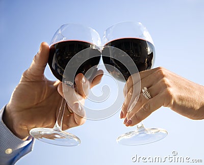 Hands Toasting with Wine Stock Photo