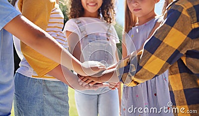 Hands together, support and children outdoor, solidarity and trust with motivation, games or growth. Closeup, kids or Stock Photo