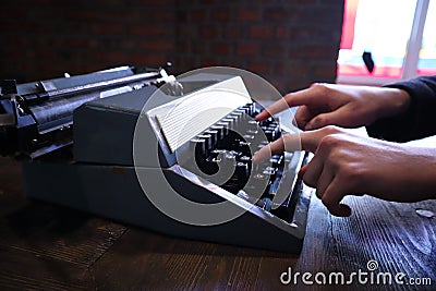 Hands typing on vintage typewriter Stock Photo