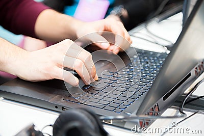 Hands of unrecognisable cropped young man typing on laptop computer Stock Photo