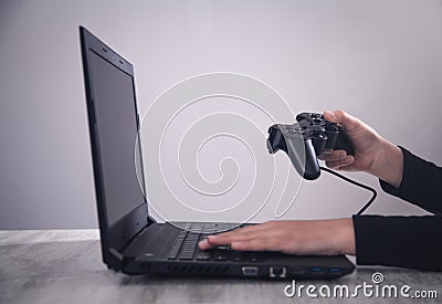Hands using game controller. Playing video games Stock Photo