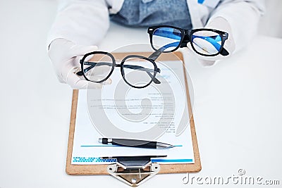 Hands, vision and glasses test with consulting and healthcare contract in consultation with support. Hospital, lens care Stock Photo