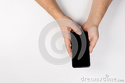 Hands with wall cell phone, mock up Stock Photo