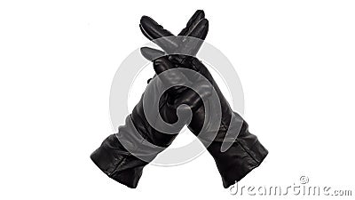 Hands wearing black leather gloves with fingers interlaced implying pause, consideration, or thinking Stock Photo