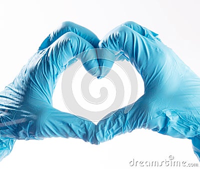 Hands wearing PPE gloves forming a shape of a heart Stock Photo