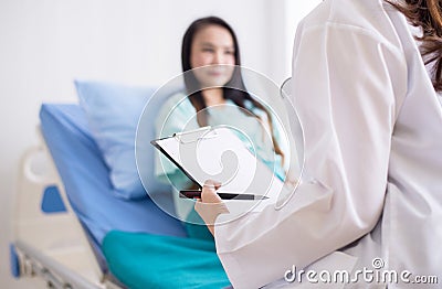 Hands woman doctor reassuring her female patient in hospital room,Doctor giving a consultation and encouragement to patient, Stock Photo