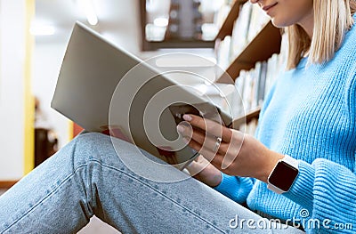 Hands, woman and reading books on library floor, ground and campus learning. Closeup student, textbook and studying of Stock Photo