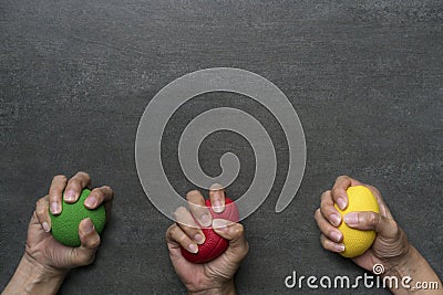 Hands of a woman squeezing a stress balls Stock Photo