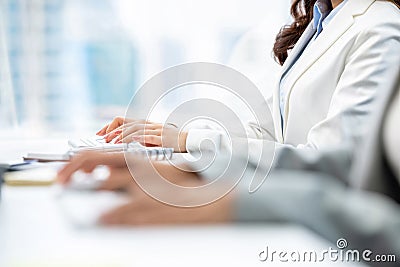 Hands of woman white collar workers typing on computer keyboards Stock Photo