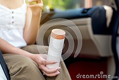 Hand woman using reusable drink bottle,Healthy green,Environmental friendly,Zero waste,Conscious lifestyle concept Stock Photo