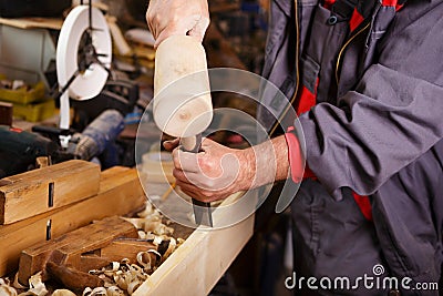 Hands woodcarver while working with the tools Stock Photo