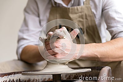 Hands working on pottery wheel Stock Photo