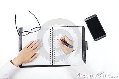 Hands write a list on personal agenda Stock Photo