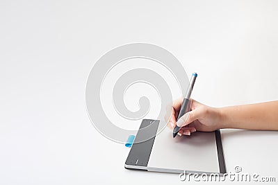 Hands writing on digital tablet Stock Photo