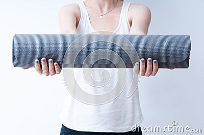 Hands on a yoga mat Stock Photo