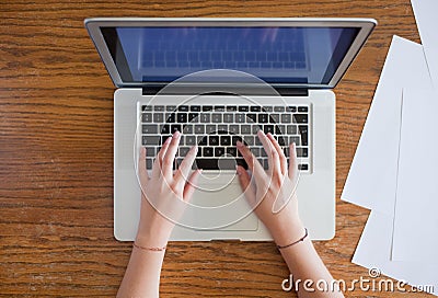 Hands of young female person typing on laptop Stock Photo