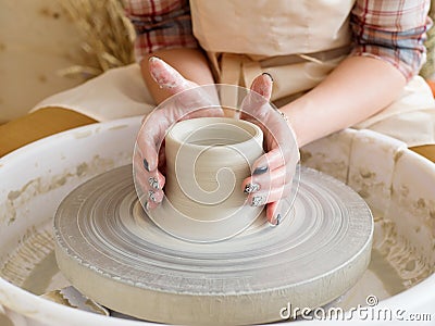 Hands of young potter, was produced on range of pot Stock Photo