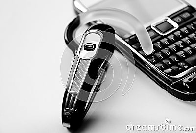 Handsfree bluetooth headset and mobile phone Stock Photo
