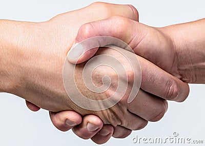 Handshake, arms friendship. Friendly handshake, friends greeting, teamwork, friendship. Close-up. Rescue, helping Stock Photo