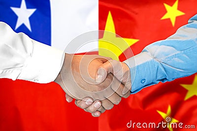 Handshake on Chile and China flag background Stock Photo