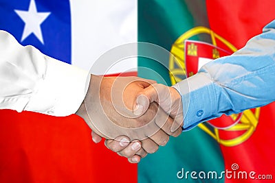 Handshake on Chile and Portugal flag background Stock Photo