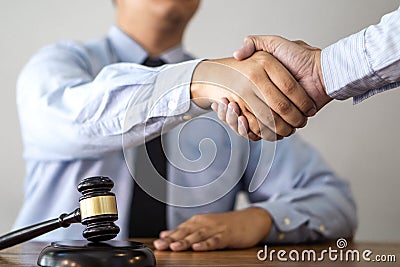 Handshake after consultation between a male lawyer and client, g Stock Photo