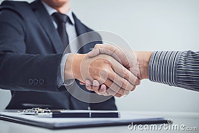 Handshake of cooperation customer and salesman after agreement, Stock Photo