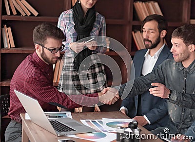 Handshake of creative partners in the design Studio Stock Photo