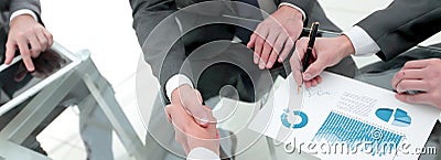 Handshake of financial partners at the Desk Stock Photo