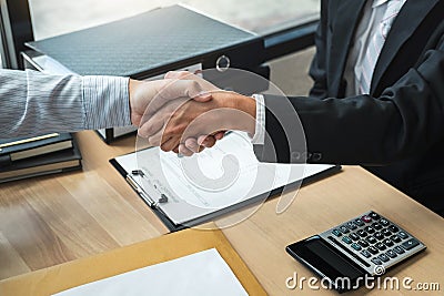 Handshake after finishing conversation Businessman sending a resignation letter to employer boss in order to resign dismiss Stock Photo