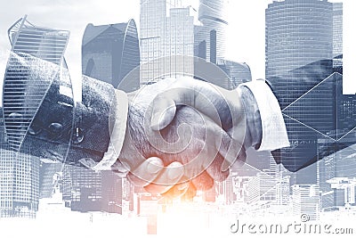 Handshake in gray Moscow city Stock Photo