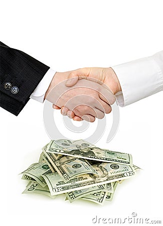 Handshake and heap of dollars Stock Photo