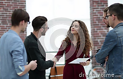 Handshake Manager and client in creative office. Stock Photo