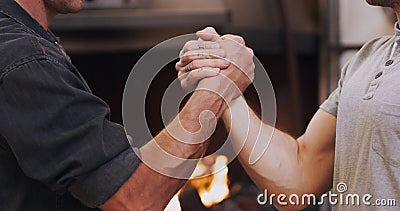 Handshake, meeting and partnership with men in a workshop together for a deal or agreement. Teamwork, welcome and Stock Photo