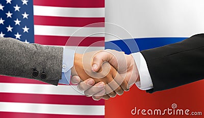 Handshake over american and russian flags Stock Photo